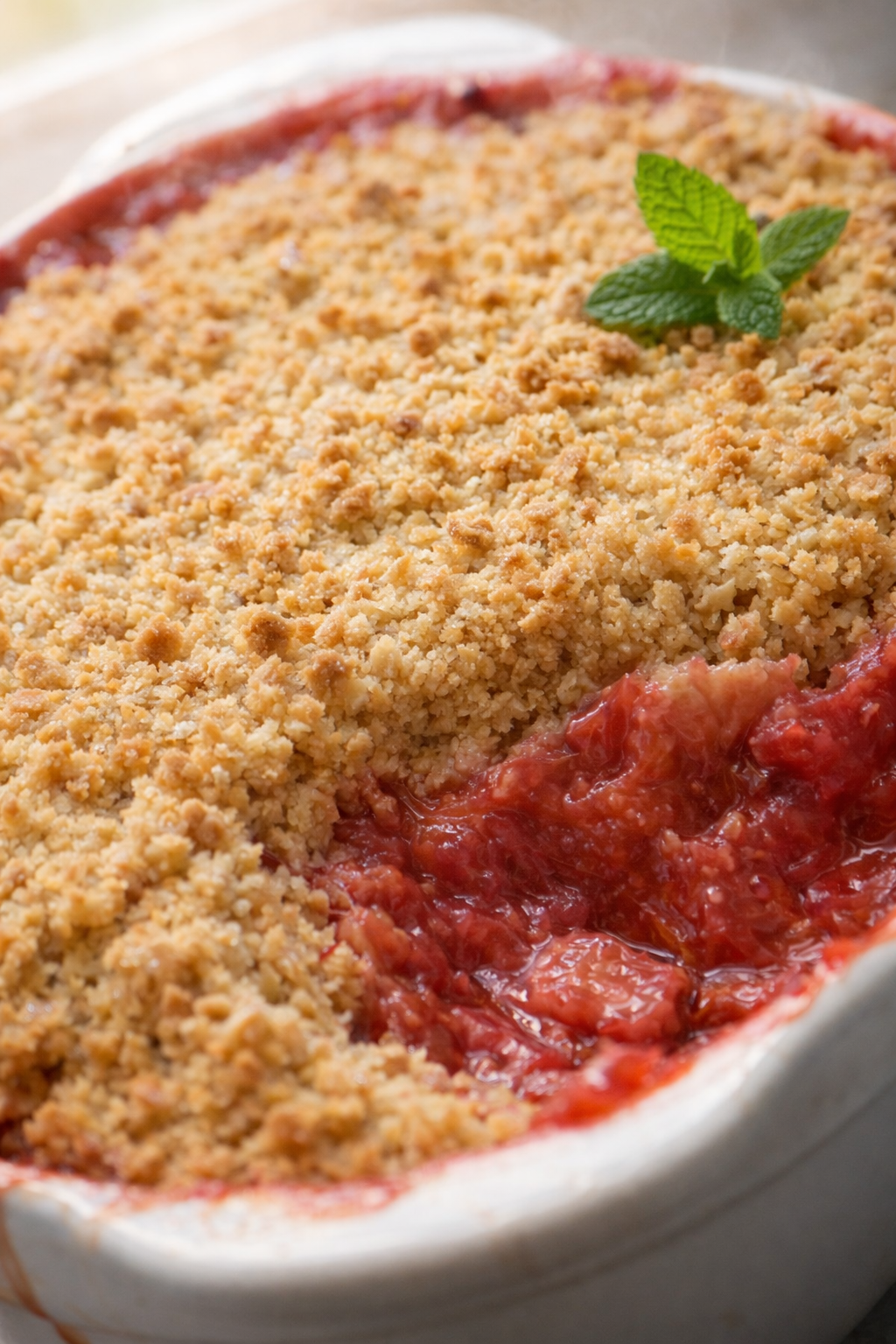 Final plated British Rhubarb Crumble served as a hero shot
