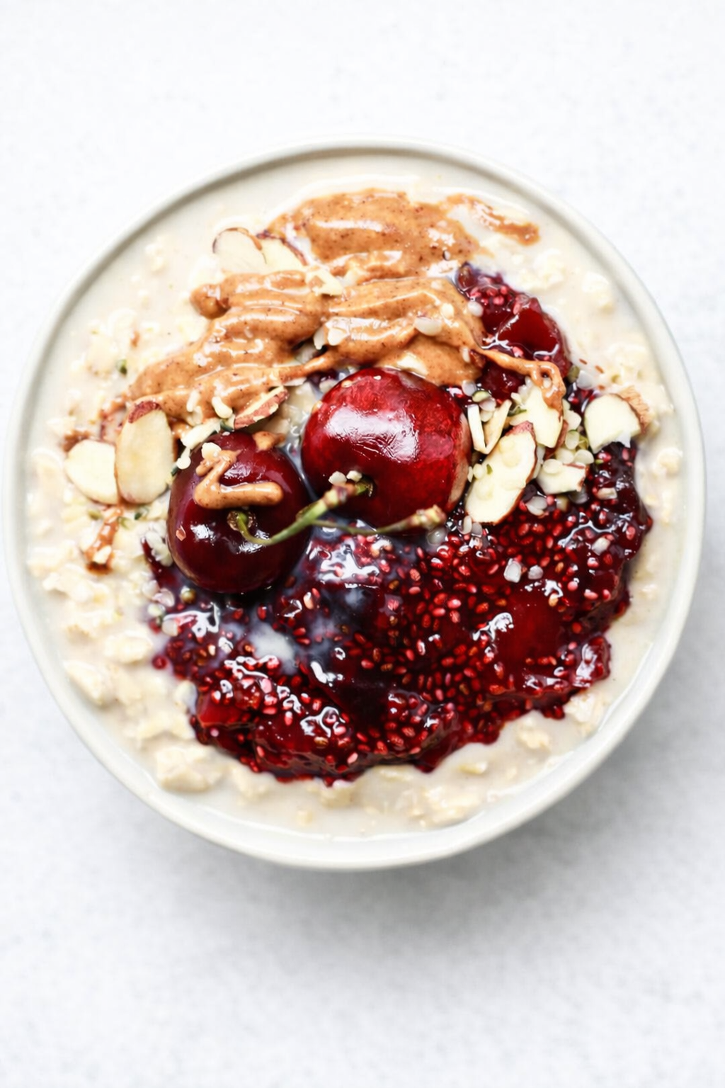 Straight-down overhead view of Healthy Overnight Oats with Cherry Chia Seed Jam