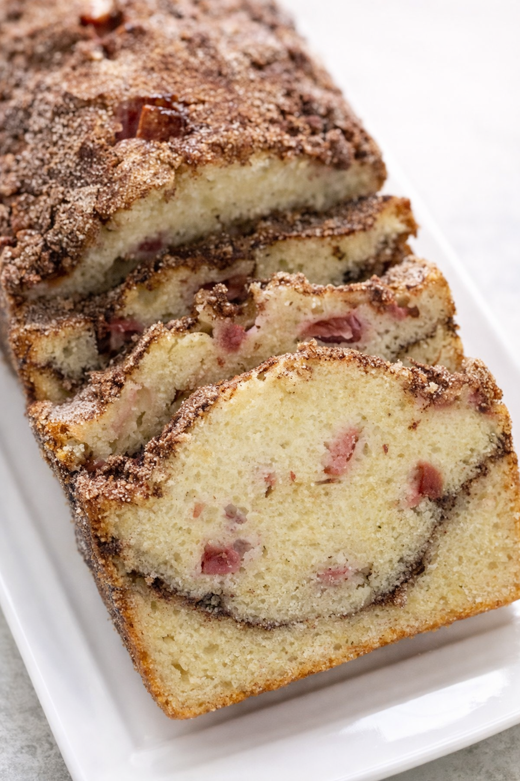 Final plated Cinnamon Swirl Rhubarb Bread served as a hero shot